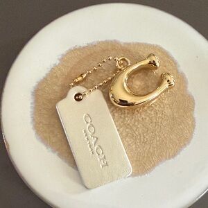 Coach Gold Horseshoe Charm with White Leather Tag